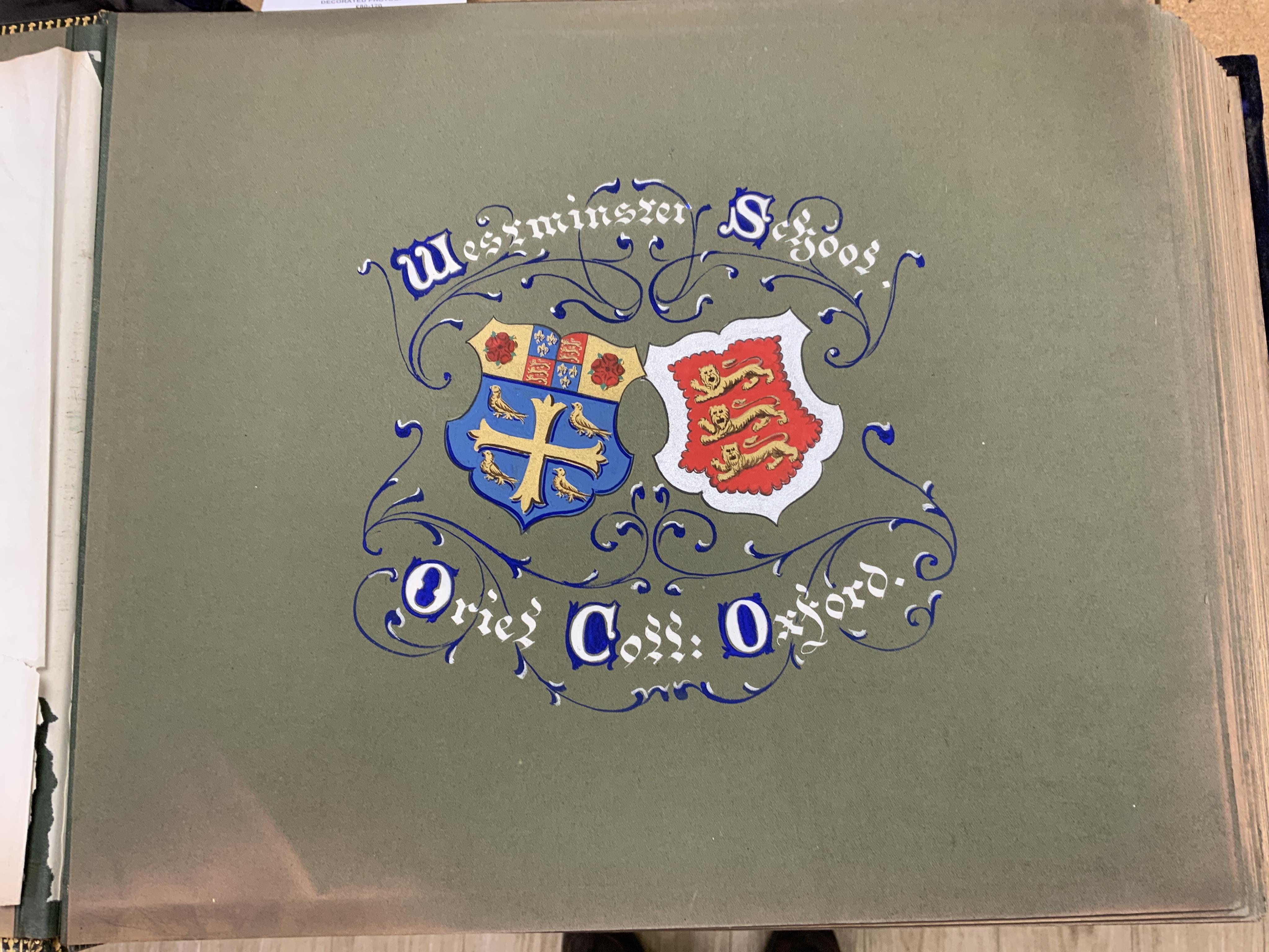 An Edwardian decorated photograph album relating to Oriel College, University of Oxford & Westminster School, with hand painted decorated titles for each mounted photograph, black-and-white photographs and bound in Oxfor